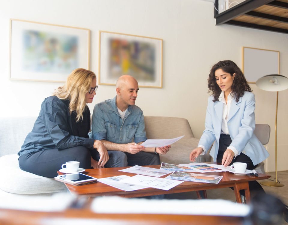 Colleagues reviewing paperwork together
